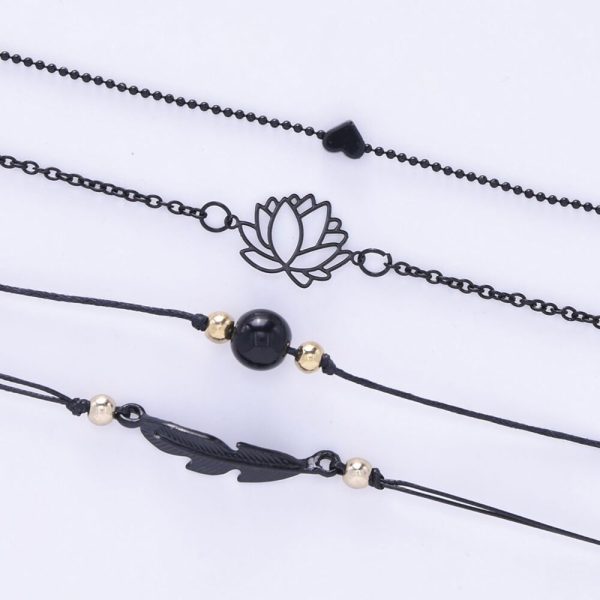 Bracelet lotus noir quatre pièces avec cœur plume et perle