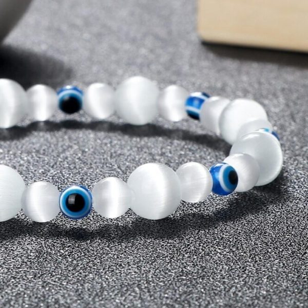 Bracelet mauvais oeil élastique avec perles blanches