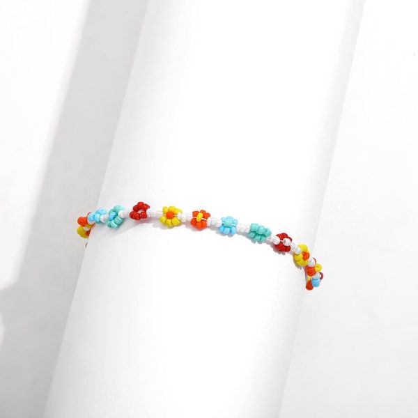 Bracelet cheville en perles et motif fleurs