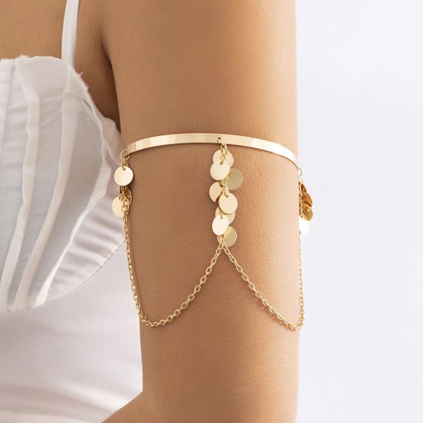 Bracelet bras avec chaînes et petits pendentifs en forme de paillette
