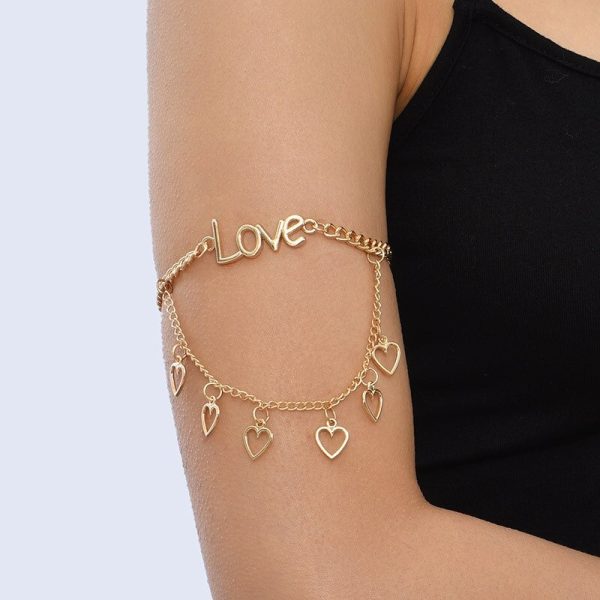 Bracelet bras dorés avec pendentifs coeur