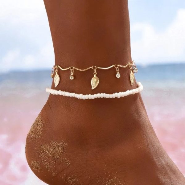 Bracelet de cheville fines chaînes dorés pendentifs étoiles et perles
