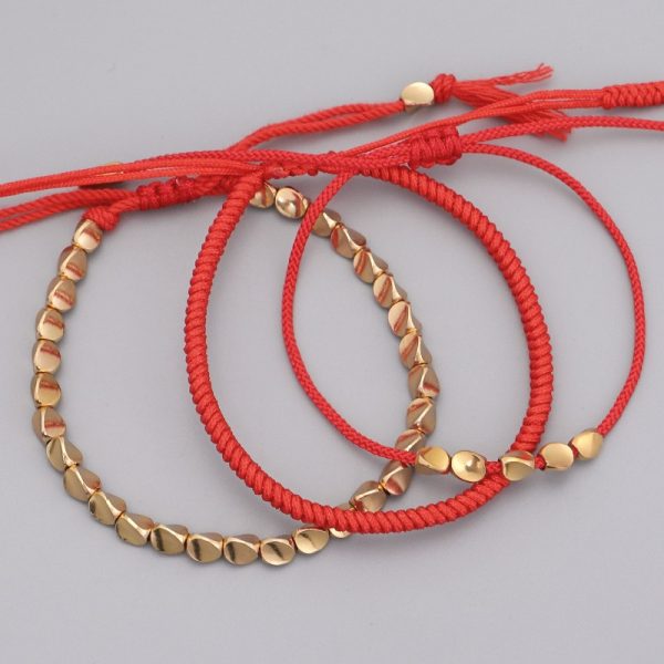 Bracelet triple bouddhiste tibétain tressé avec des perles en cuivre
