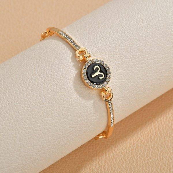 Bracelet signe astrologique chaîne dorée et strass