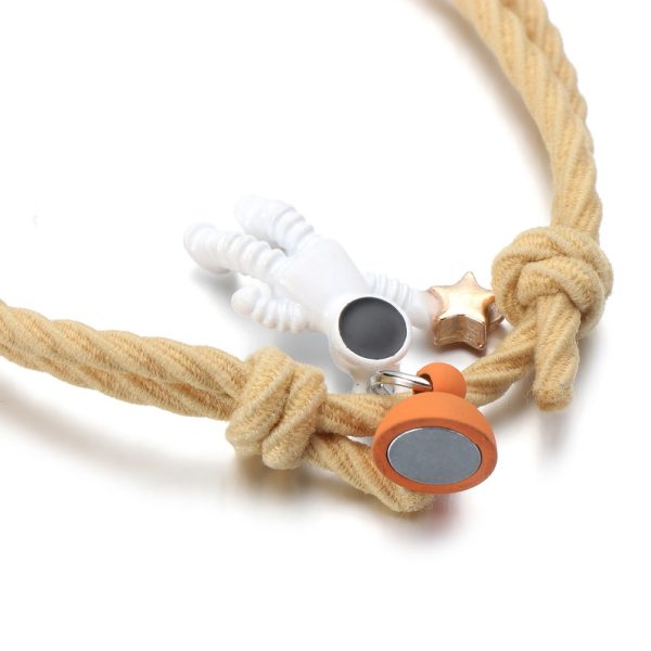 Bracelet amitié magnétique cordon ajustable pendentif astronaute