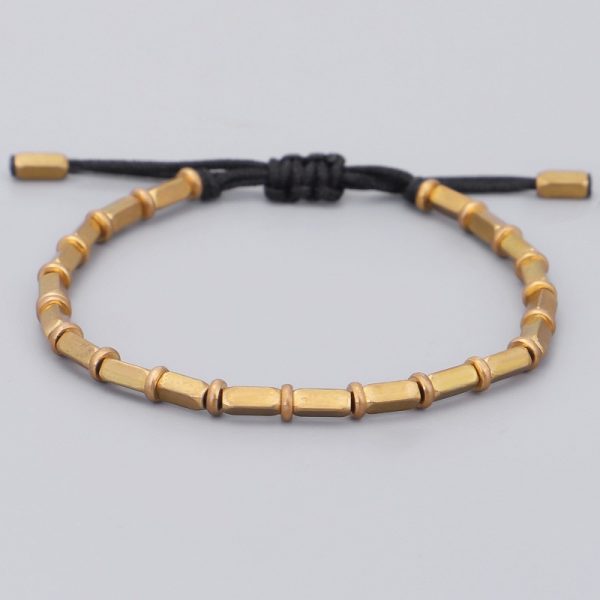 Bracelet bouddhiste tibétain, avec perles de cuivre sur corde noire