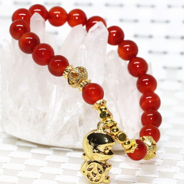 Bracelet cornaline perles rouge et pendentif singe doré