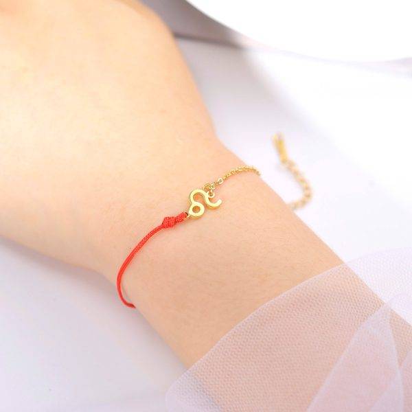 Bracelet signe astrologique doré cordon rouge ajustable